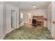 Open loft space with a functional desk area and staircase, providing flexible options for work or leisure at 4039 Holly Villa Cir, Indian Trail, NC 28079