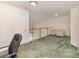 Expansive loft featuring a comfortable couch and railing, ideal for additional living or entertainment space at 4039 Holly Villa Cir, Indian Trail, NC 28079