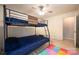Bedroom features a blue bunk bed, ceiling fan, and wood-look floors at 4487 Catawba Burris Rd, Denver, NC 28037