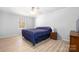 Cozy bedroom features wood flooring and a ceiling fan to help keep the space cool and comfortable at 4487 Catawba Burris Rd, Denver, NC 28037