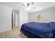 Bedroom features wood flooring and a ceiling fan, a place of tranquility after a long day at 4487 Catawba Burris Rd, Denver, NC 28037