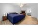 Bedroom with a ceiling fan, wood flooring and a view of the bathroom with a dressing mirror at 4487 Catawba Burris Rd, Denver, NC 28037