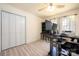 Bright bedroom/office with hardwood floors, closet space, ceiling fan, and well-lit with natural light at 4487 Catawba Burris Rd, Denver, NC 28037
