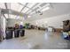 Spacious garage with high ceilings, storage, and multiple doors, ready for cars and projects at 4487 Catawba Burris Rd, Denver, NC 28037