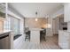 Well-lit kitchen with a center island, breakfast bar, stainless steel appliances, and access to the backyard at 4487 Catawba Burris Rd, Denver, NC 28037