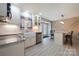 Bright kitchen features white cabinets, granite countertops, stainless steel appliances, and breakfast bar at 4487 Catawba Burris Rd, Denver, NC 28037