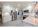 Well-lit kitchen with stainless steel appliances, white cabinetry, and a tile backsplash, providing a modern and functional space at 4487 Catawba Burris Rd, Denver, NC 28037