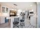 Spacious kitchen featuring a center island, breakfast bar, wine cooler, and stainless steel appliances at 4487 Catawba Burris Rd, Denver, NC 28037