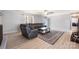 Light-filled living room with sleek furniture and wood-look floors, offering a modern and comfortable living space at 4487 Catawba Burris Rd, Denver, NC 28037