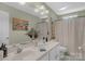 Spacious bathroom with a double sink vanity, ample counter space, and large decorative mirrors at 4586 Chanel Ct, Concord, NC 28025