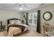 Inviting bedroom featuring a decorative mirror and a comfortable bed with a patterned coverlet at 4586 Chanel Ct, Concord, NC 28025