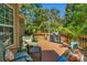 Relaxing deck area with comfortable seating, a grill, and decorative plants at 4586 Chanel Ct, Concord, NC 28025