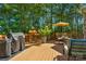 Spacious wooden deck with outdoor seating and a barbecue grill, perfect for entertaining at 4586 Chanel Ct, Concord, NC 28025