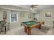Game room with billiards table, ceiling fan, natural light and casual seating at 4586 Chanel Ct, Concord, NC 28025