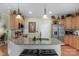 Kitchen with a spacious island, stainless steel appliances, and wooden cabinets at 4586 Chanel Ct, Concord, NC 28025