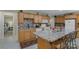 Well-equipped kitchen featuring a spacious island with seating and sleek, modern appliances at 4586 Chanel Ct, Concord, NC 28025