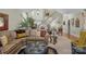 Open living room with staircase, hardwood floors, and comfortable seating arrangement at 4586 Chanel Ct, Concord, NC 28025