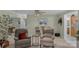 Seating area with matching chairs, small tables and greenery at 4586 Chanel Ct, Concord, NC 28025