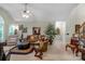 Spacious living room with comfortable seating, ceiling fan, and open layout at 4586 Chanel Ct, Concord, NC 28025