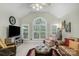 Cozy living room featuring a vaulted ceiling, plantation shutters, and comfortable seating at 4586 Chanel Ct, Concord, NC 28025