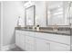 Elegant bathroom featuring double sinks with granite countertops and modern fixtures at 5025 Antebellum Dr, Iron Station, NC 28080