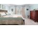 Relaxing bedroom featuring a wooden bedframe, soft carpet, and natural light at 5025 Antebellum Dr, Iron Station, NC 28080