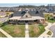 Aerial view of community clubhouse boasting stylish architecture, lush landscaping, and inviting outdoor spaces at 5025 Antebellum Dr, Iron Station, NC 28080
