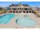 Aerial image showcasing the community pool with various lounge chairs, a splash pad, and the clubhouse at 5025 Antebellum Dr, Iron Station, NC 28080