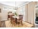 Elegant dining room with a chandelier, large window, and stylish furnishings for Gathering gatherings at 5025 Antebellum Dr, Iron Station, NC 28080