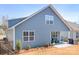 Exterior of a blue two-story home with covered porch and black metal fence at 5025 Antebellum Dr, Iron Station, NC 28080