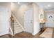 Inviting foyer with hardwood floors, stairs to the upper level, and access to other areas of the home at 5025 Antebellum Dr, Iron Station, NC 28080