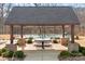Community pickleball court featuring covered seating area with a picnic table for residents' enjoyment and recreation at 5025 Antebellum Dr, Iron Station, NC 28080