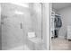 Modern marble tiled shower with glass door and built-in bench in bathroom at 5025 Antebellum Dr, Iron Station, NC 28080