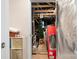 Unfinished storage space with exposed rafters, Christmas tree, and various storage containers at 5025 Antebellum Dr, Iron Station, NC 28080