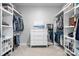 Spacious walk-in closet with custom shelving and drawers to maximize storage and organization at 5025 Antebellum Dr, Iron Station, NC 28080