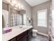 Well-lit bathroom with vanity, framed mirror, and shower-tub combo at 514 Baucom Deese Rd, Monroe, NC 28110
