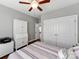Bedroom featuring hardwood floors, a closet, and a light-colored wall at 514 Baucom Deese Rd, Monroe, NC 28110