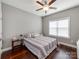 Bright bedroom with a ceiling fan, hardwood floors, and a large window providing natural light at 514 Baucom Deese Rd, Monroe, NC 28110