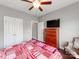 Cozy bedroom with cherry dresser, ceiling fan, and closet with paneled doors at 514 Baucom Deese Rd, Monroe, NC 28110