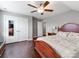 Spacious bedroom featuring hardwood floors, paneled closet doors, and a ceiling fan at 514 Baucom Deese Rd, Monroe, NC 28110