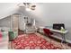 Upstairs bonus room with sloped ceilings and hardwood floors at 514 Baucom Deese Rd, Monroe, NC 28110