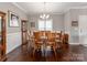 Formal dining room with hardwood floors, wainscoting, and a traditional chandelier at 514 Baucom Deese Rd, Monroe, NC 28110