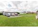 Large three-car garage on a spacious green lot with additional parking at 514 Baucom Deese Rd, Monroe, NC 28110