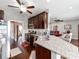 A spacious kitchen features dark wood cabinets, granite countertops, stainless steel appliances, and hardwood floors at 514 Baucom Deese Rd, Monroe, NC 28110