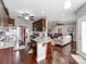 Open concept kitchen with granite counters, dark wood cabinets, and views into the living area at 514 Baucom Deese Rd, Monroe, NC 28110