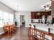 Eat-in kitchen featuring an island with bar seating, dark wood cabinets, and hardwood flooring at 514 Baucom Deese Rd, Monroe, NC 28110