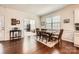 Traditional dining room features wainscoting, dark wood flooring, and adjoins the office at 525 Cellini Pl, Mount Holly, NC 28120
