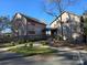 Unique exterior featuring a ramp, wooden siding, colorful accents and landscaping for a charming look at 525 Cellini Pl, Mount Holly, NC 28120