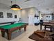 Fun-filled game room with a pool table, foosball, and ample space for recreation and entertainment at 525 Cellini Pl, Mount Holly, NC 28120
