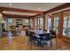 Spacious interior featuring wood floors, wooden beams, a fireplace, ample seating, and a sliding glass door at 525 Cellini Pl, Mount Holly, NC 28120